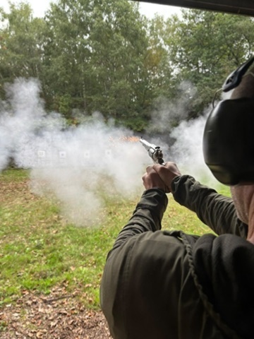 Member firing a rifle at the woodland range — enlarge photo